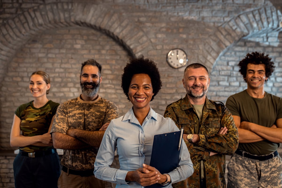 Veterans smiling together at a peer support group