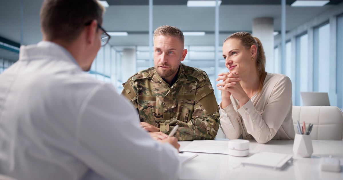 A therapist supporting a veteran client through a counseling session